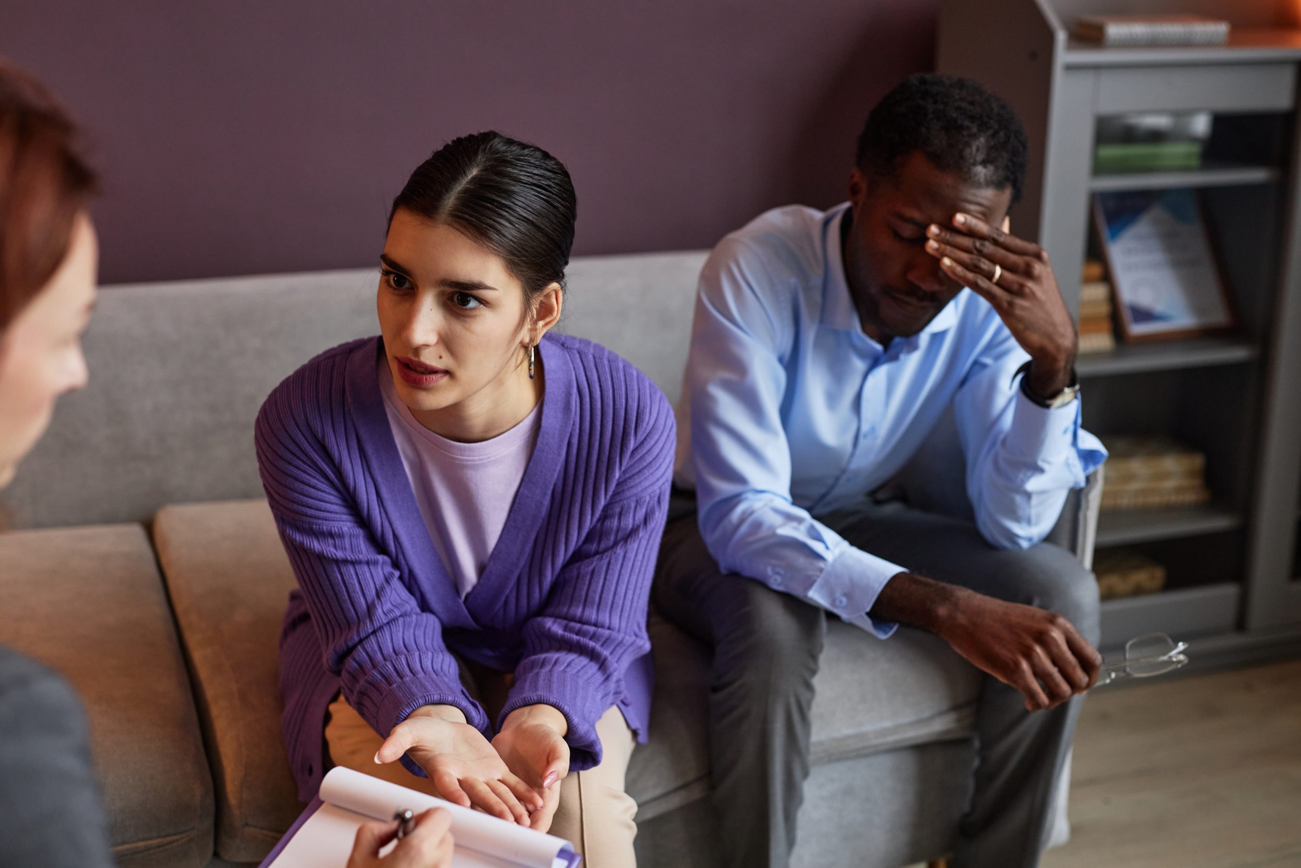 Frustrated-couple-in-a-counseling-session-discussing-relationship-issues.-Costa-Mesa-Divorce-Lawyer-offering-professional-legal-guidance-for-separation-and-divorce-scaled